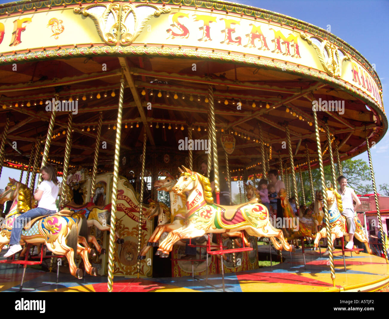 Horses traditional fairground merry go round carousel Stock Photo - Alamy