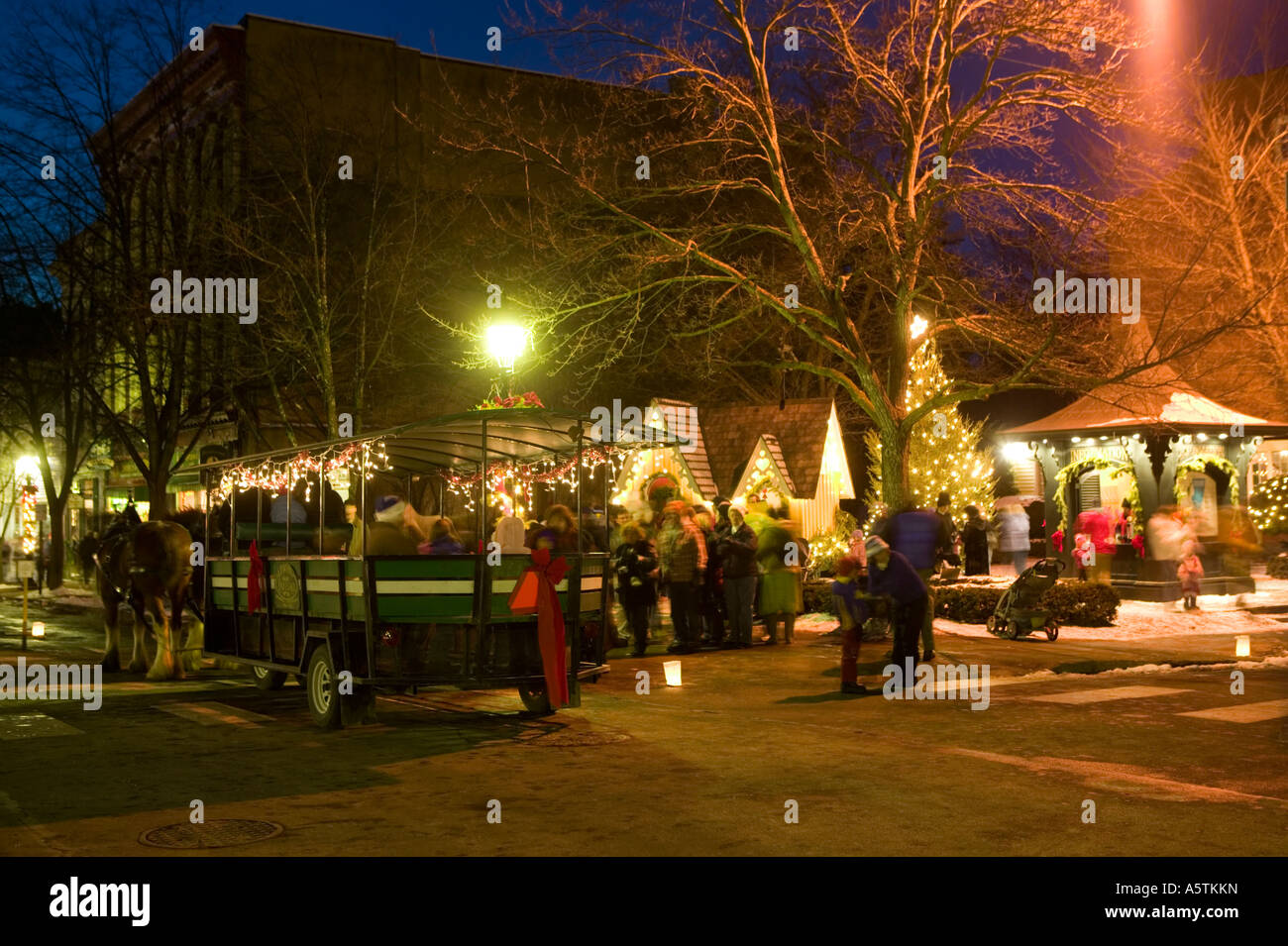 Candlelight stroll Christmas time Cooperstown New York horse drawn