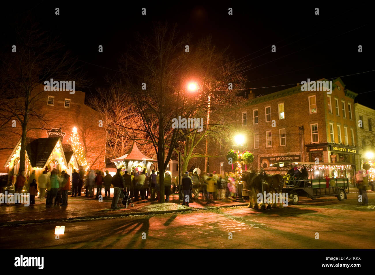 Candlelight stroll Christmas time Cooperstown New York horse drawn
