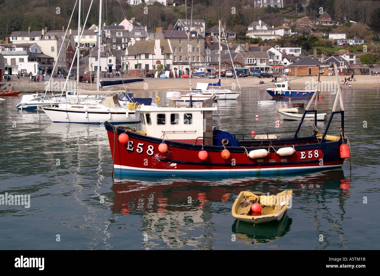 Anchored fishing boat in harbour Lyme Regis Dorset England 2005 Stock Photo