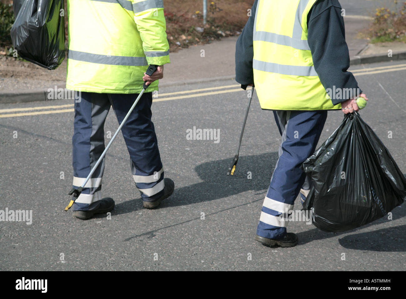 council workers collecting rubbish Stock Photo Alamy