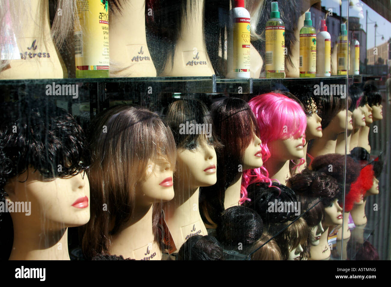 shop window of wigs Stock Photo Alamy