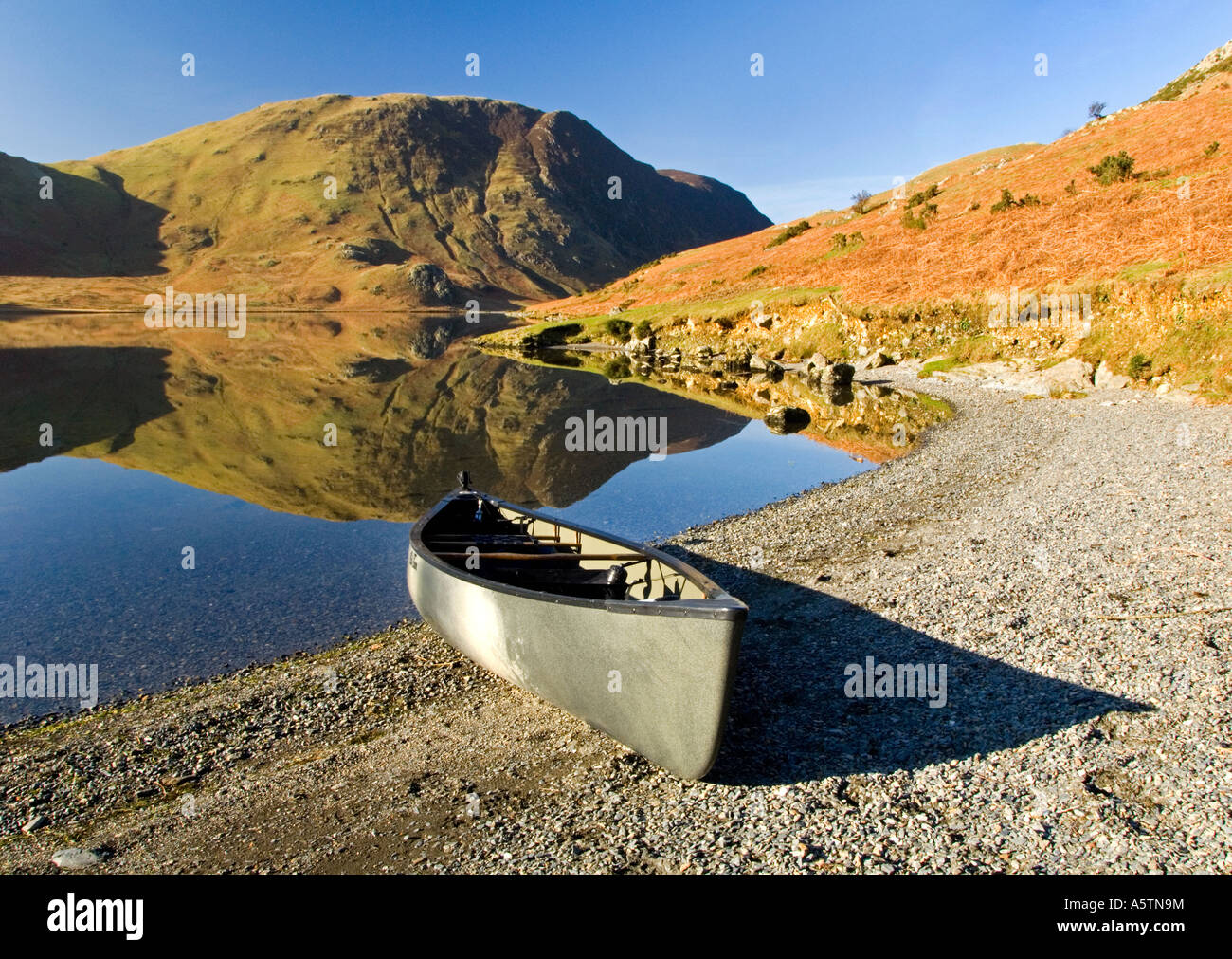 Silver Canoe on the Shores of Crummock Water, Lake District, National Park, Cumbria, England, UK Stock Photo