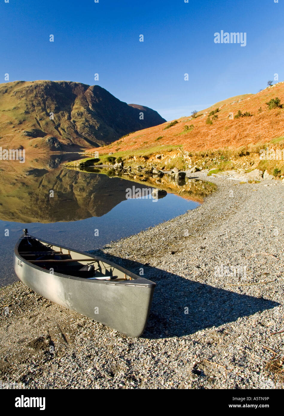 Silver Canoe on the Shores of Crumock Water, Lake District National Park, Cumbria, England, UK Stock Photo