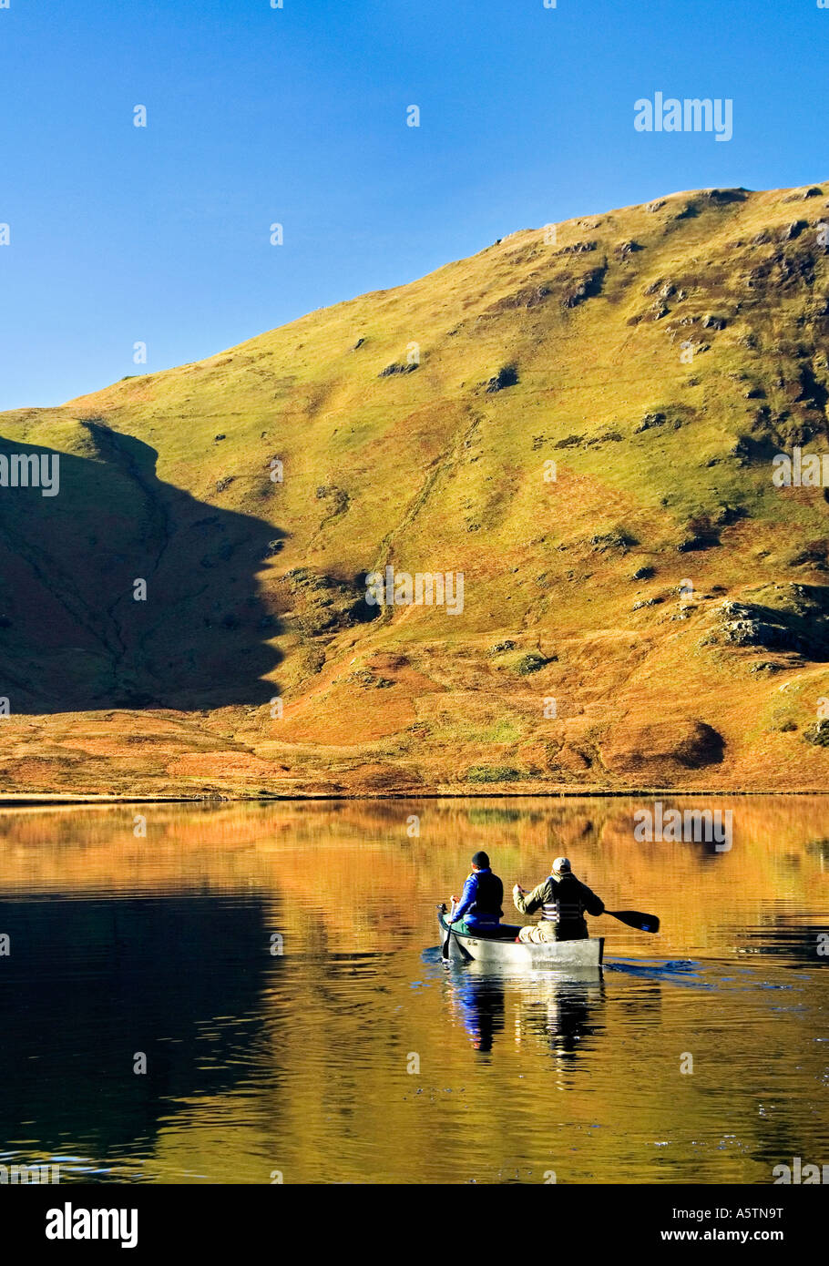 Two People Canoeists on Crummock Water, Lake District National Park, Cumbria, England, UK Stock Photo