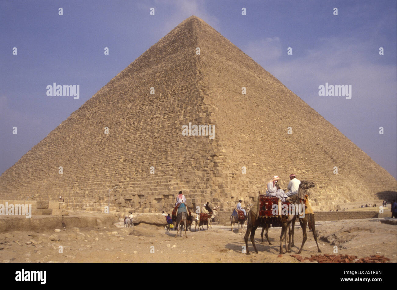Camel riders near the Pyramid of Cheops Giza near Cairo Egypt north ...