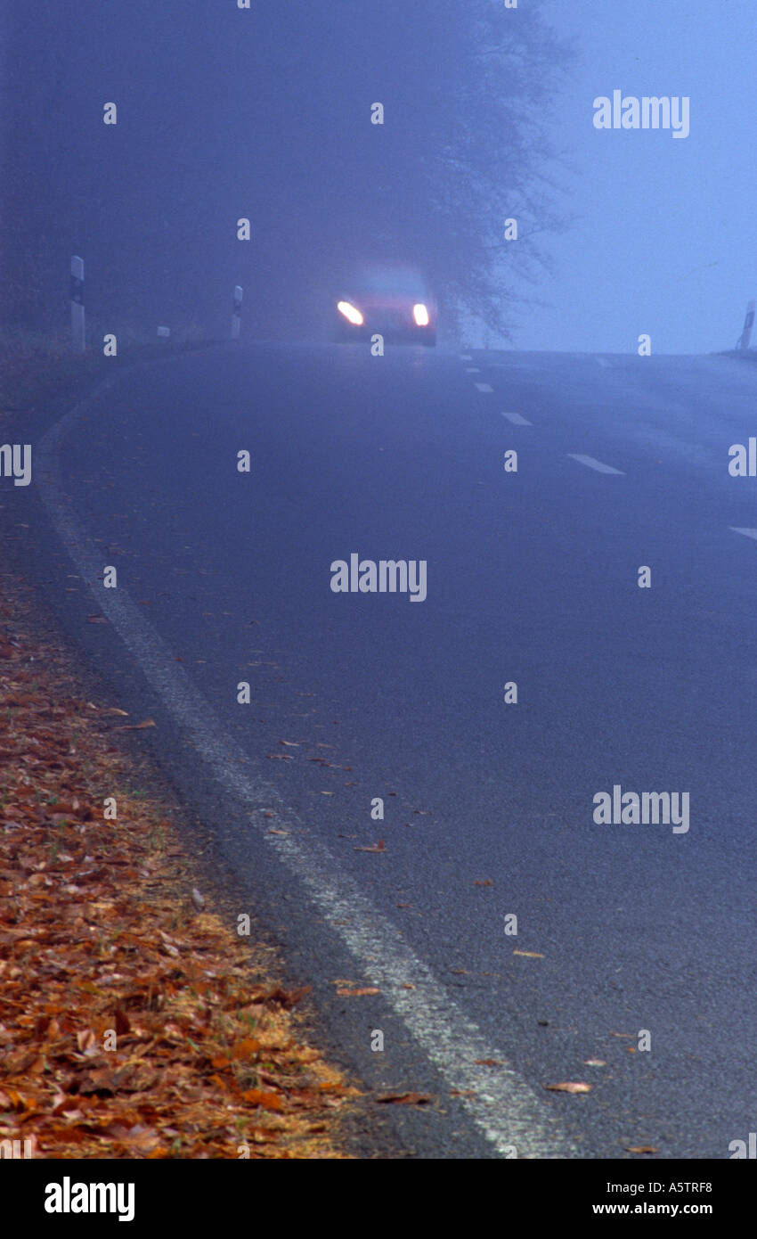 car on country road in fog Stock Photo - Alamy