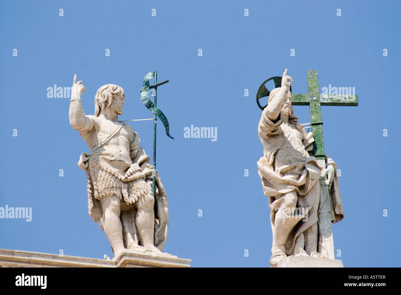 Statues on the top of st peters basilica hires stock photography and