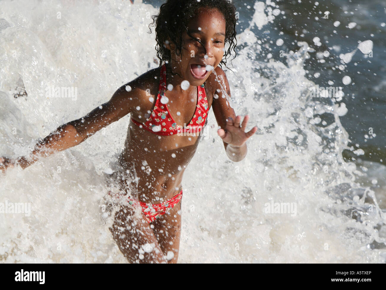 Fun portrait of little tanned young girl in bikini coming out of the sea  smiling, Copacabana beach, Rio de Janeiro, Brazil Stock Photo - Alamy