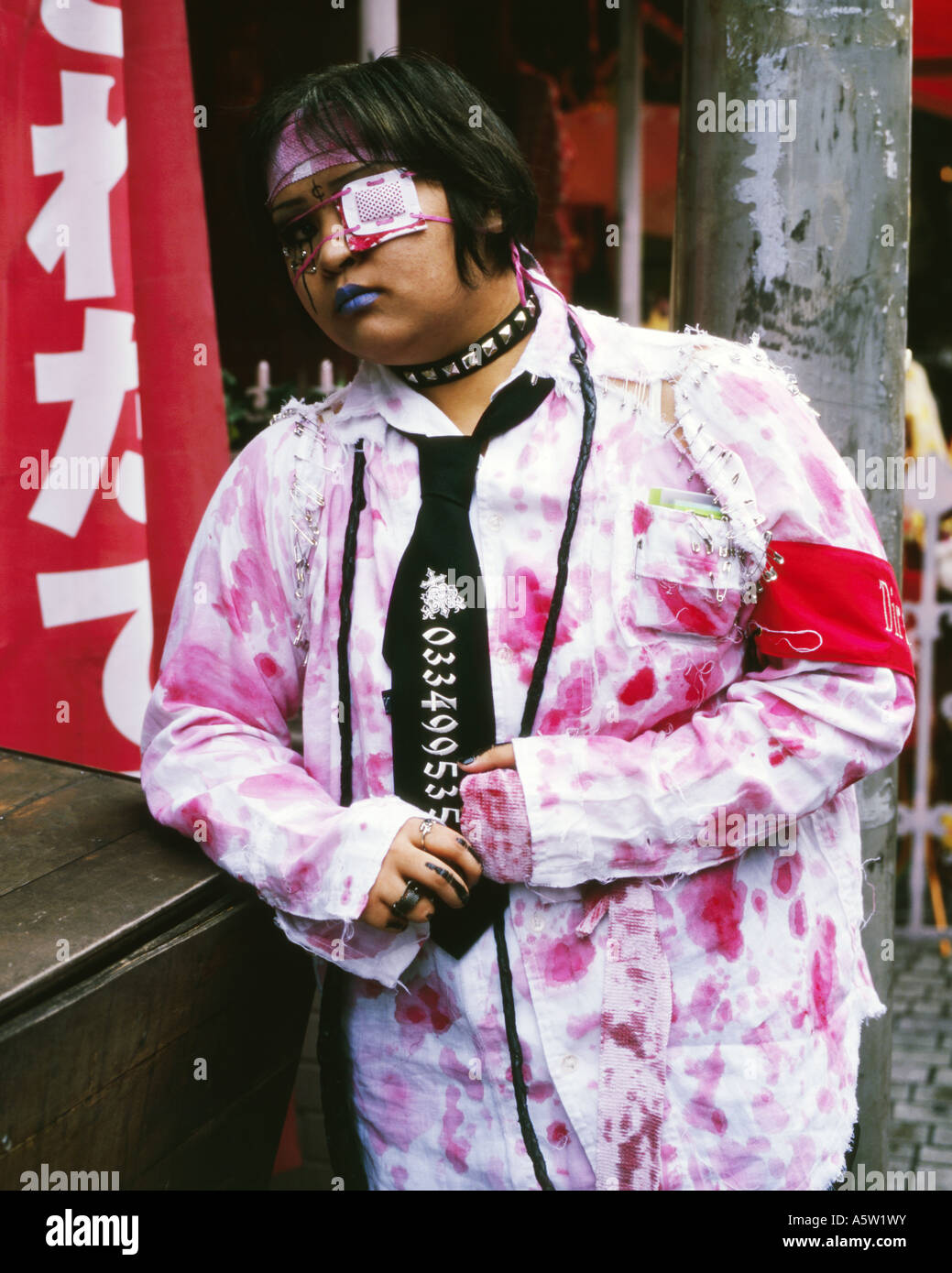 young female punk dressed in outrageous clothes takeshita street harajuku tokyo japan Stock Photo