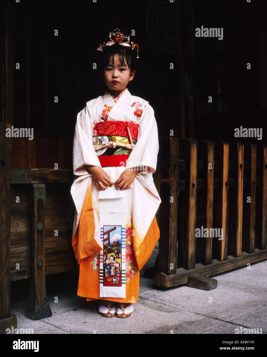 young local girl dressed immaculately in traditional geisha clothing tokyo japan Stock Photo