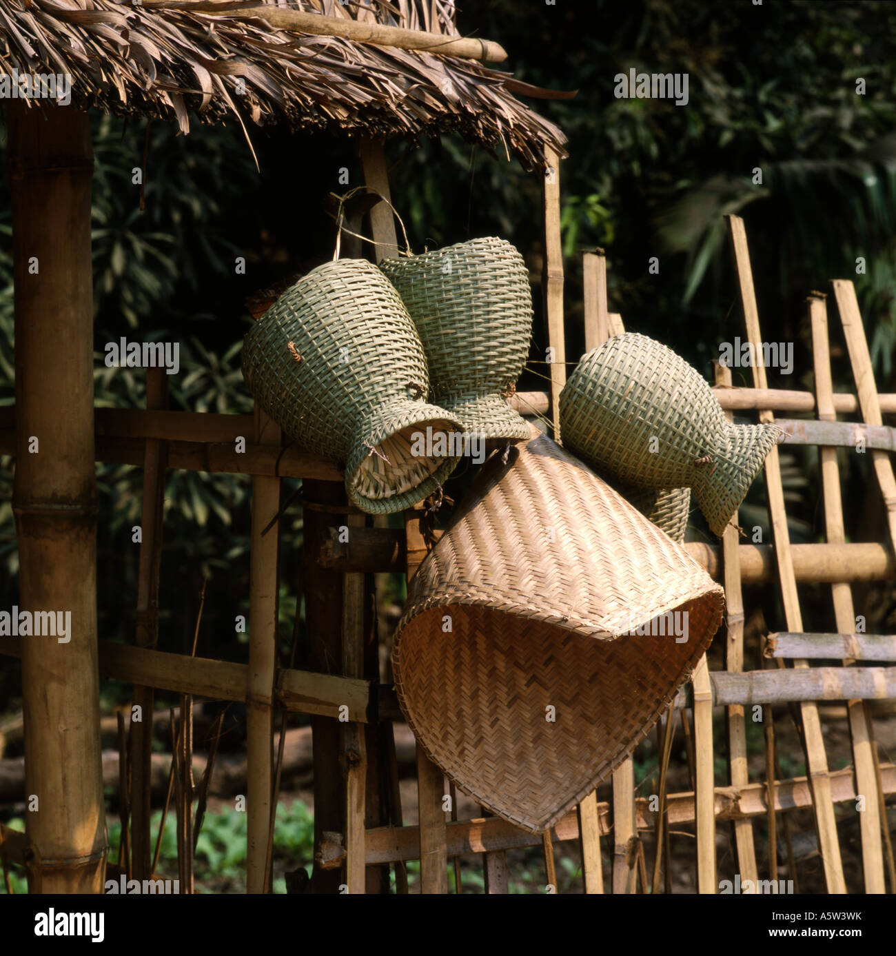 Traditional wicker baskets hang outside of rural house in small village