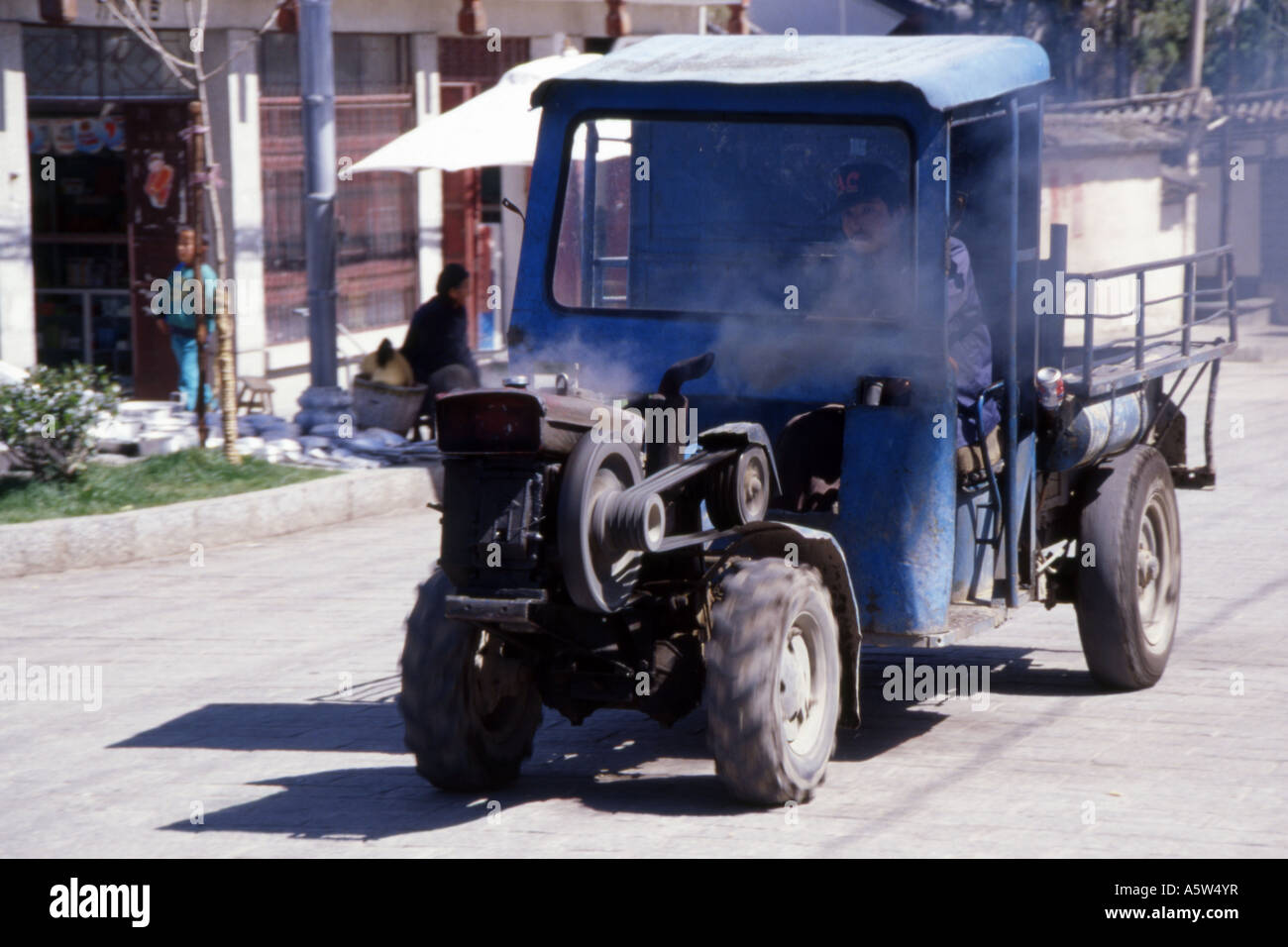 Typical rural transport,truck with open engine at front belching fumes,Dali,Yunnan Province,China. Stock Photo