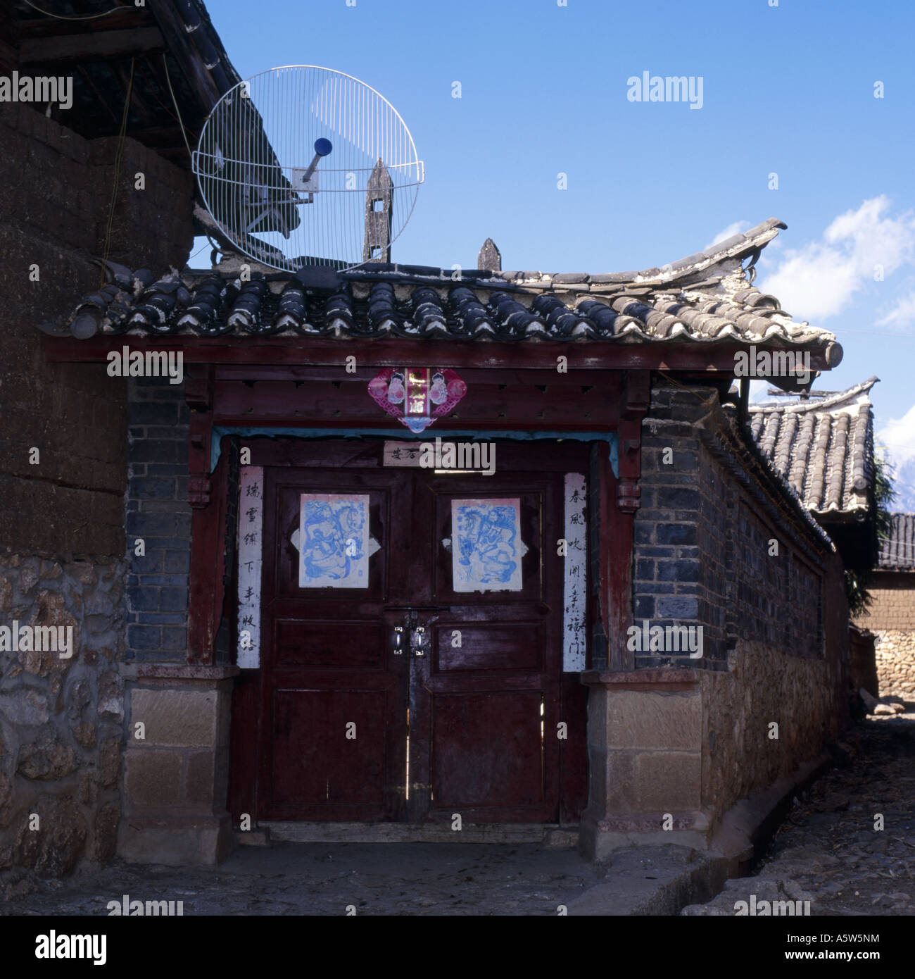 Traditional wooden gateway of rural village house and contrasting