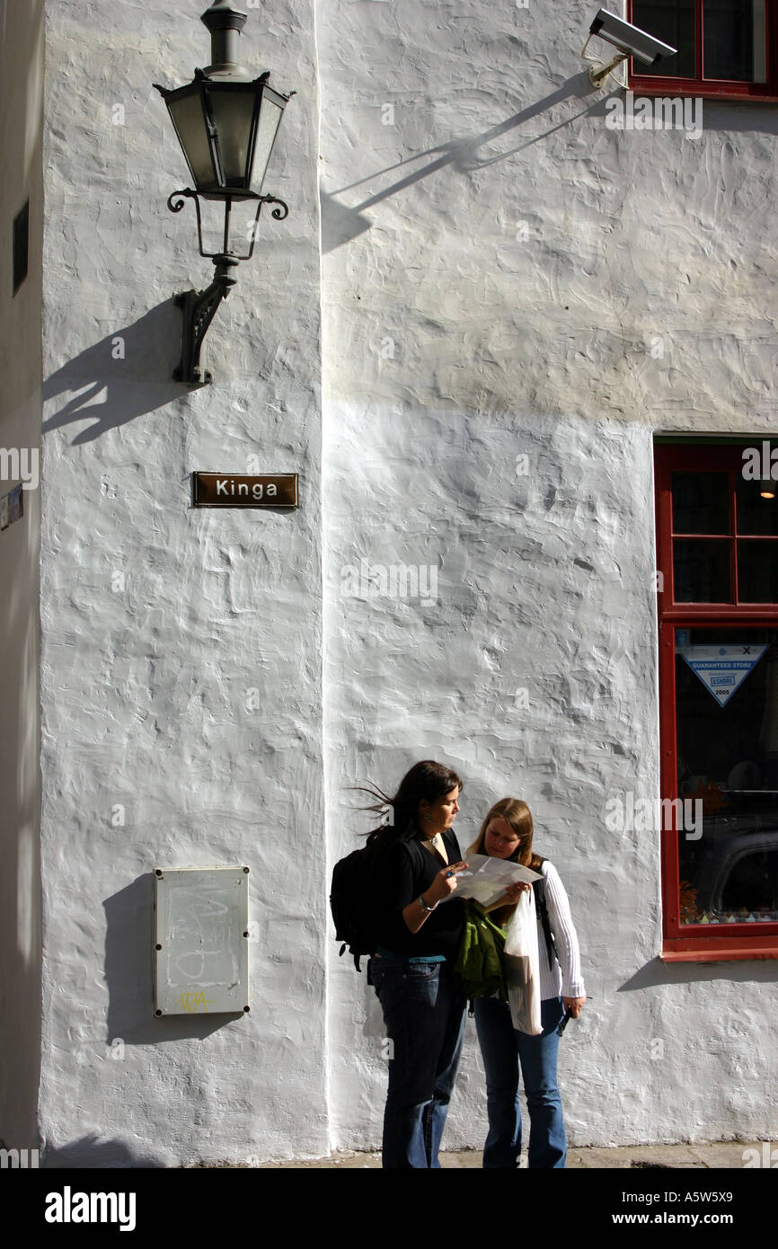 Tourists Reading A Map In Tallinn Old Town In Estonia Stock Photo
