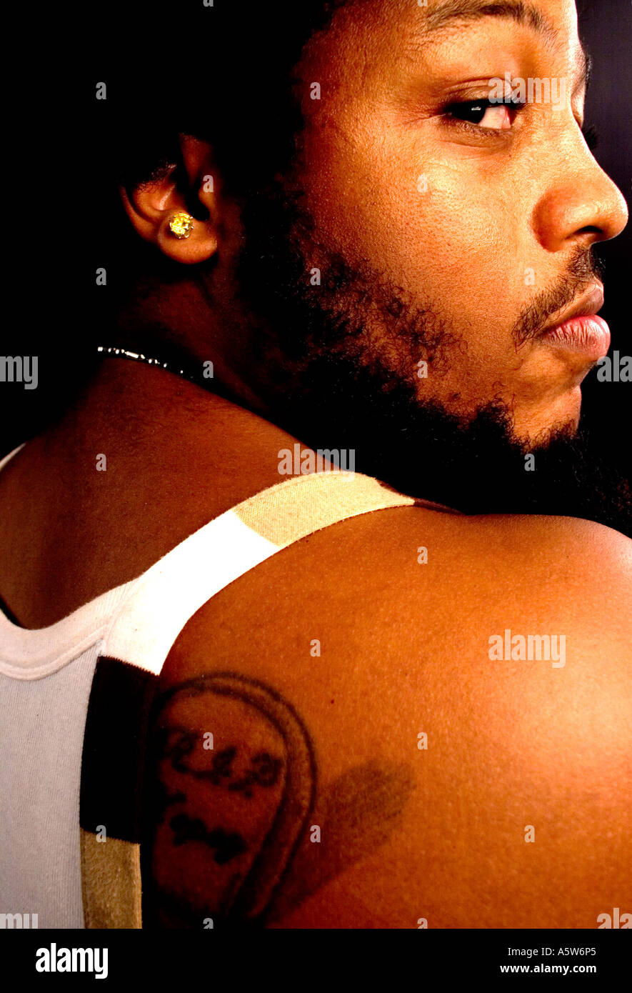 Black man looking back over shoulder Stock Photo - Alamy