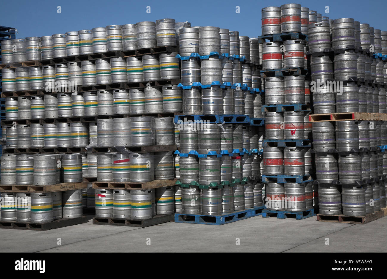 Barrels of beer stacked high on pallets Stock Photo Alamy