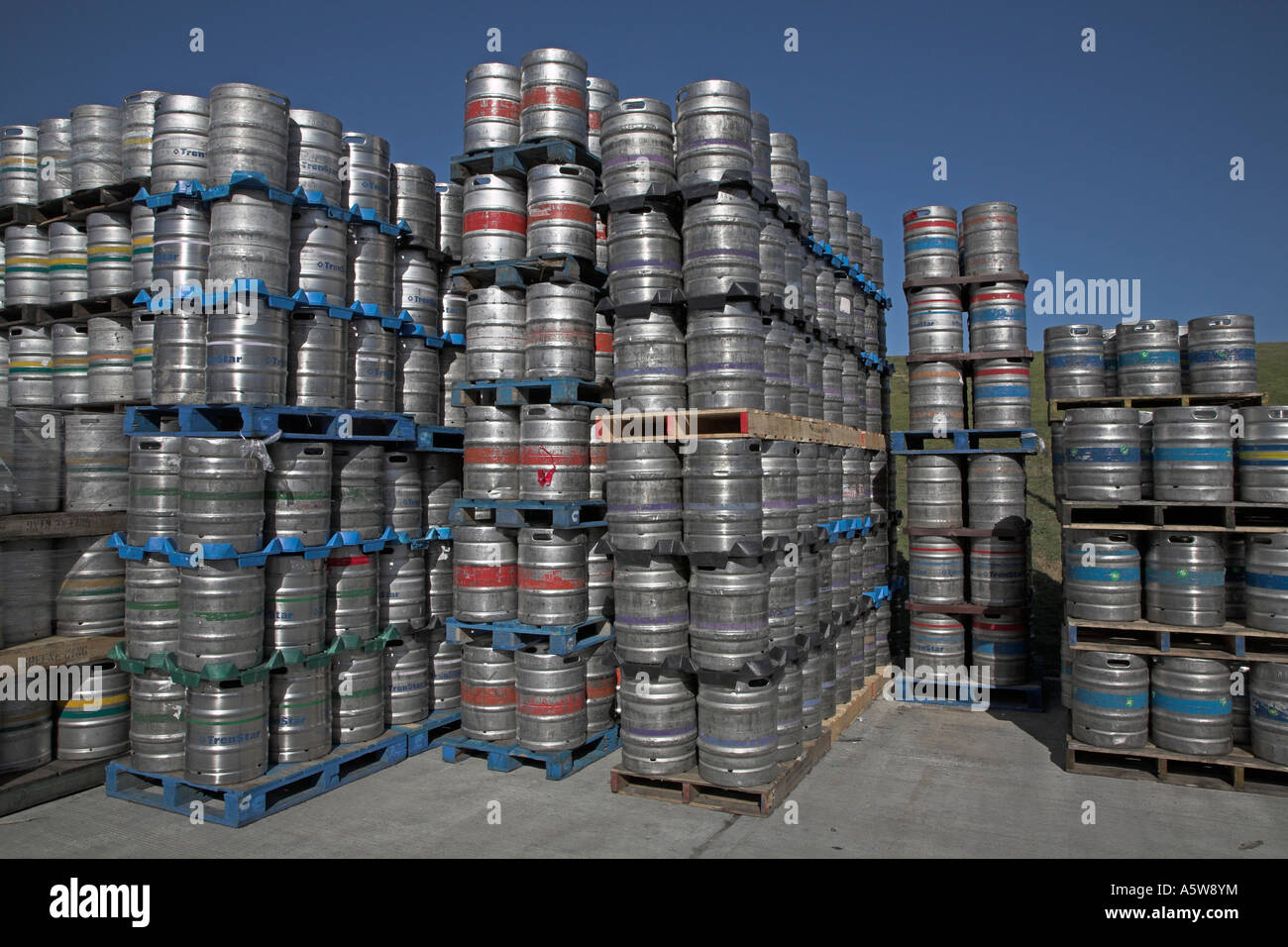 Barrels of beer stacked high on pallets Stock Photo Alamy