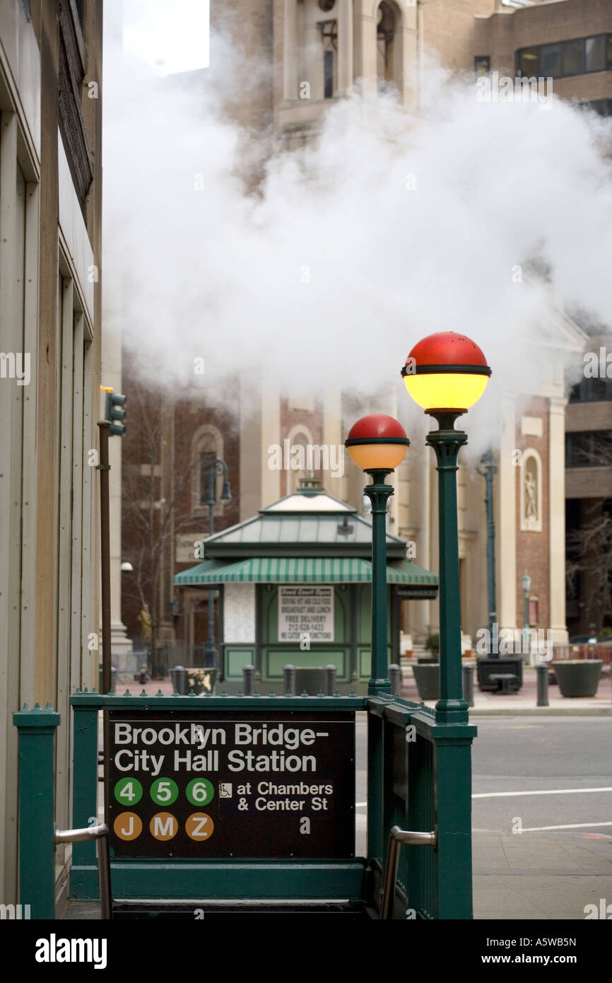 Brooklyn Bridge and City hall subway station with steam in New York USA