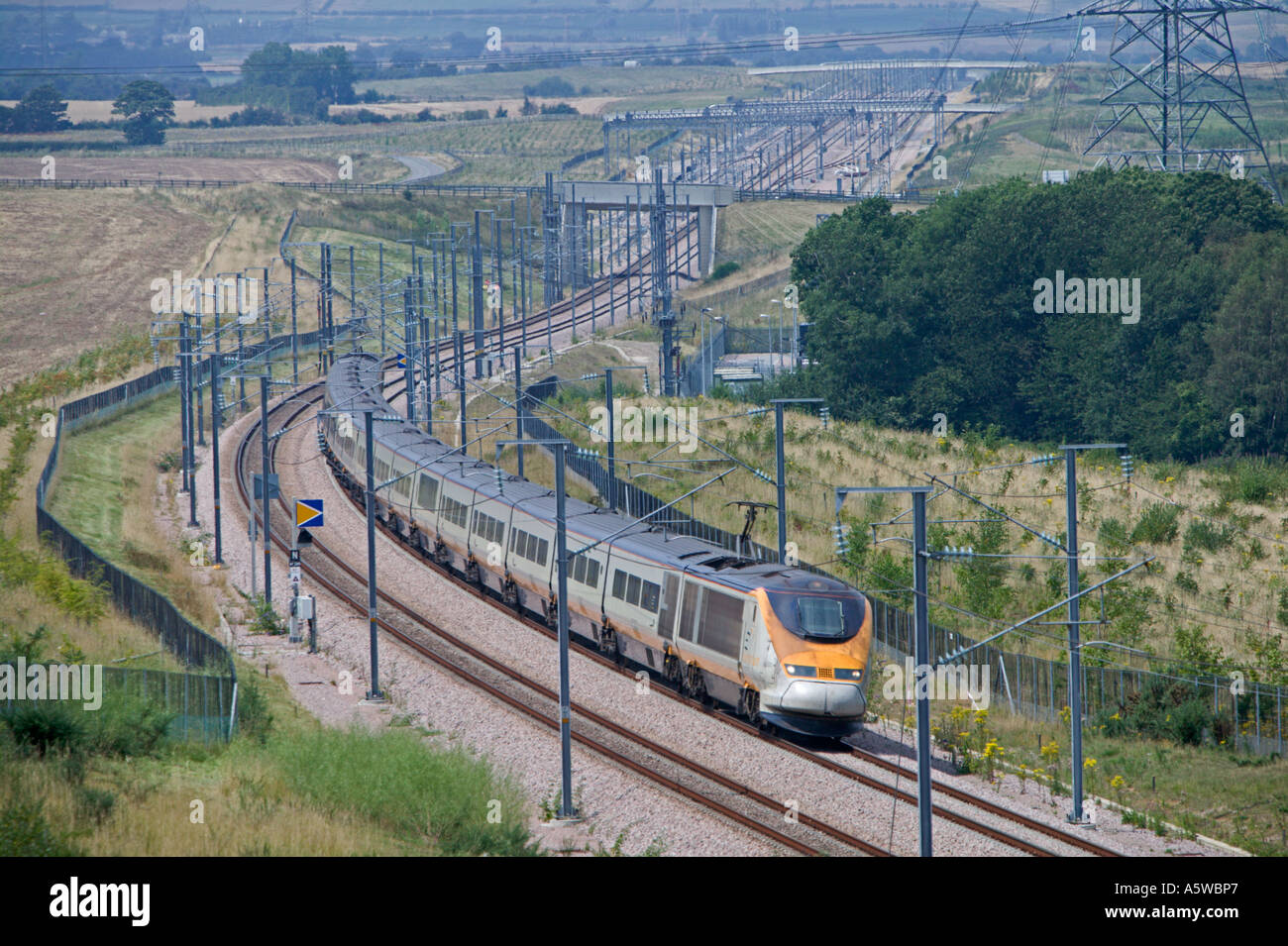 Eurostar train operating at speed on the High Speed One  (Channel Tunnel Rail Link), leaning into a cambered bend. Stock Photo