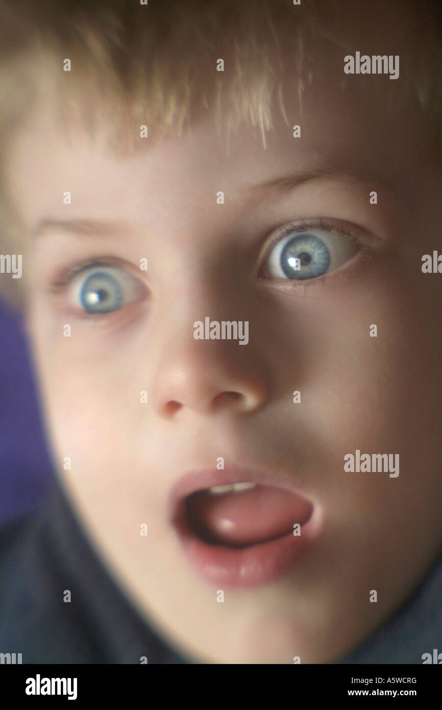 Boy with Amazed look on his face eyes wide open Stock Photo