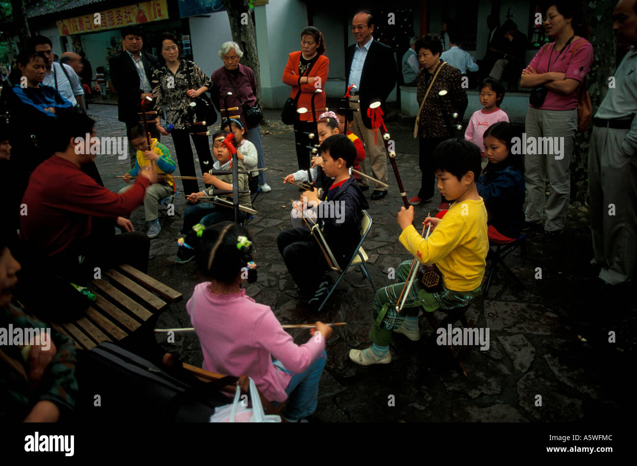 Children playing musical instruments Lu Xun Park Shanghai China Stock Photo