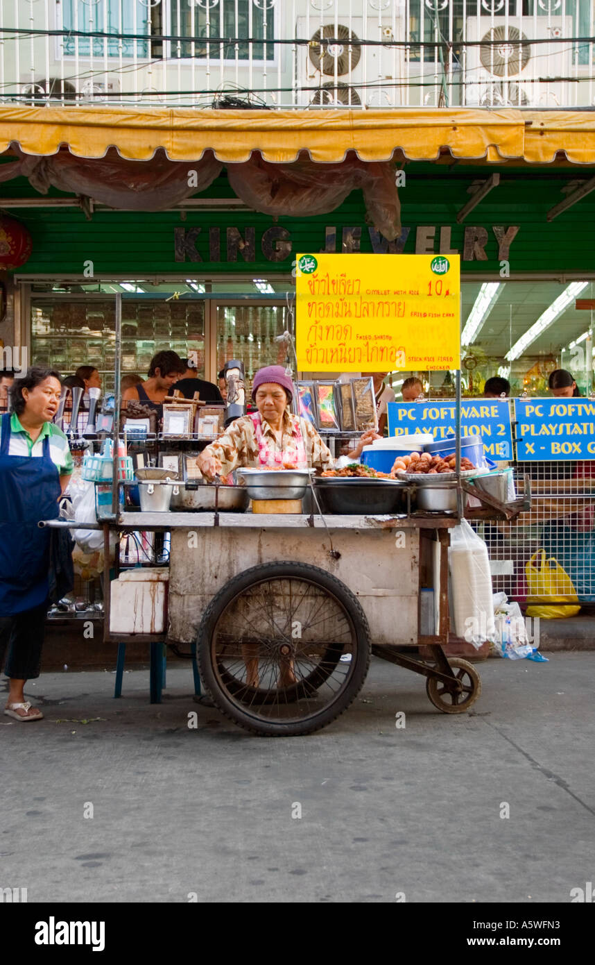 Woman market trader tend food at Khao San Road Market in Bangkok Thailand Stock Photo Alamy