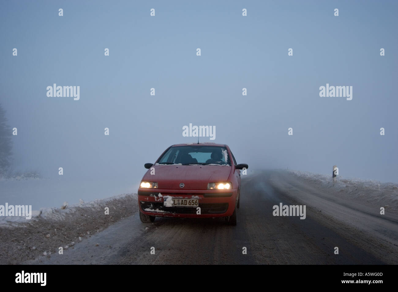 headlight Fiat Punto in winter Germany Stock Photo