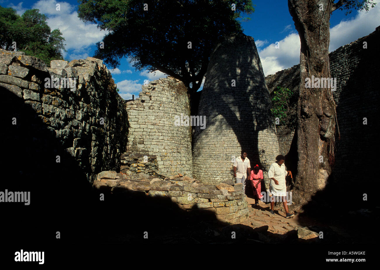 Walking past Conical Tower in the Great Enclosure, Great  Zimbabwe National Monument, Southern Zimbabwe,  Africa Stock Photo