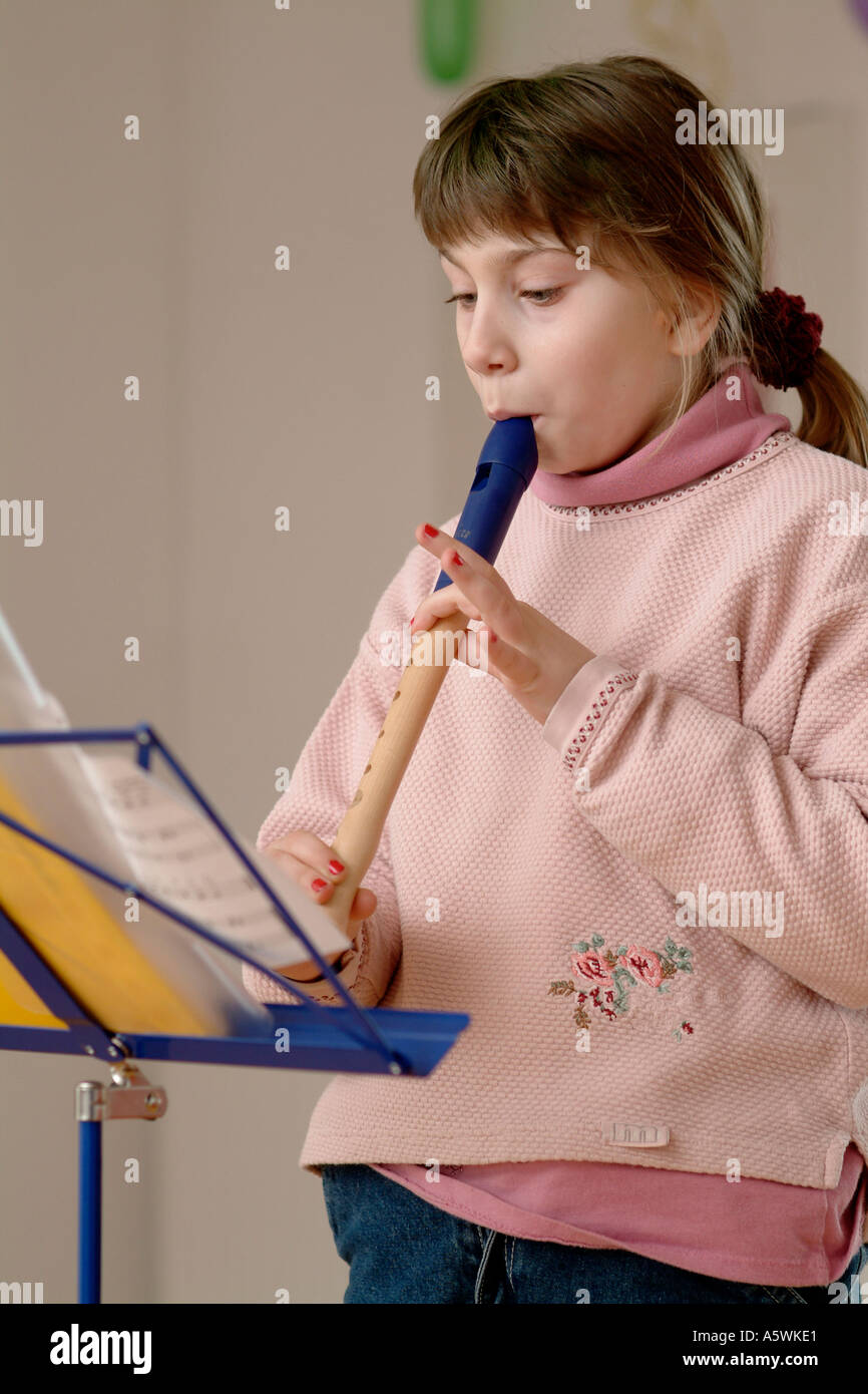 child plays flute Stock Photo Alamy