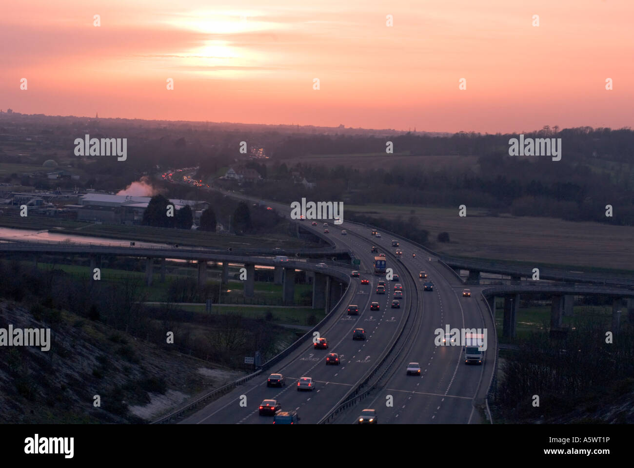 Traffic ,cars ,lorries Two way ,three lane ,motorway ,sunset ,Sussex ,UK Stock Photo