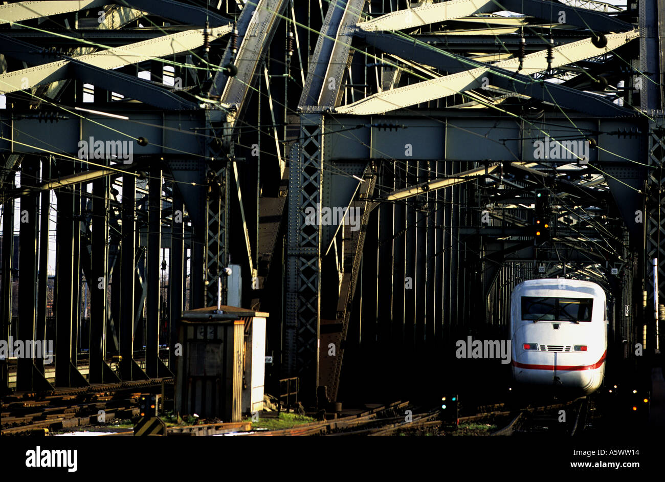 High speed passenger train entering the Hohenzollern bridge, Cologne, Germany. Stock Photo