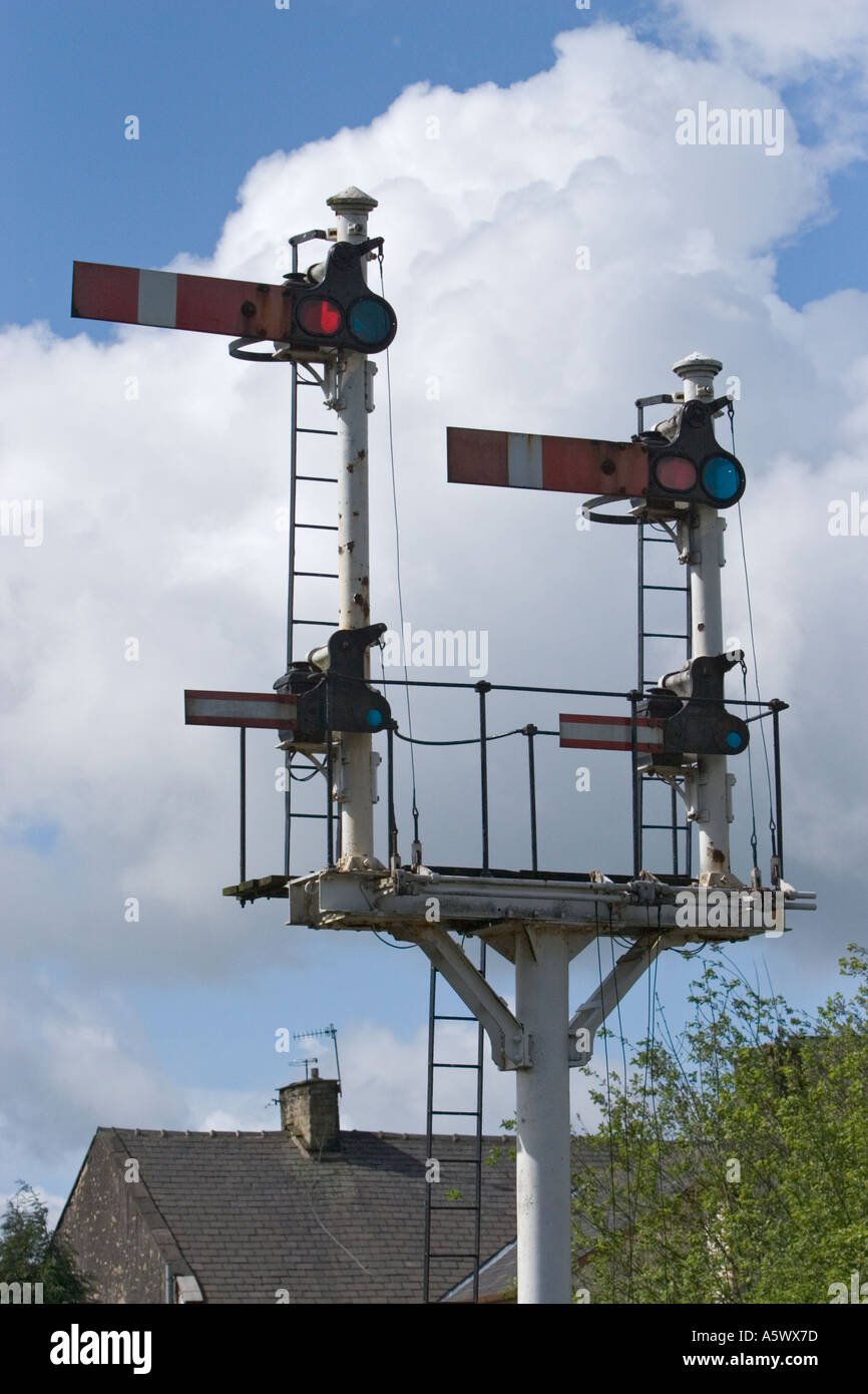 Railway signals with cumulus clouds in blue sky at the east lancashire railway  in ramsbottom lancashire background Stock Photo