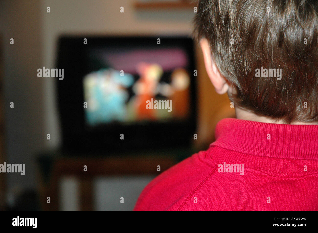 child watching cartoons on television Stock Photo