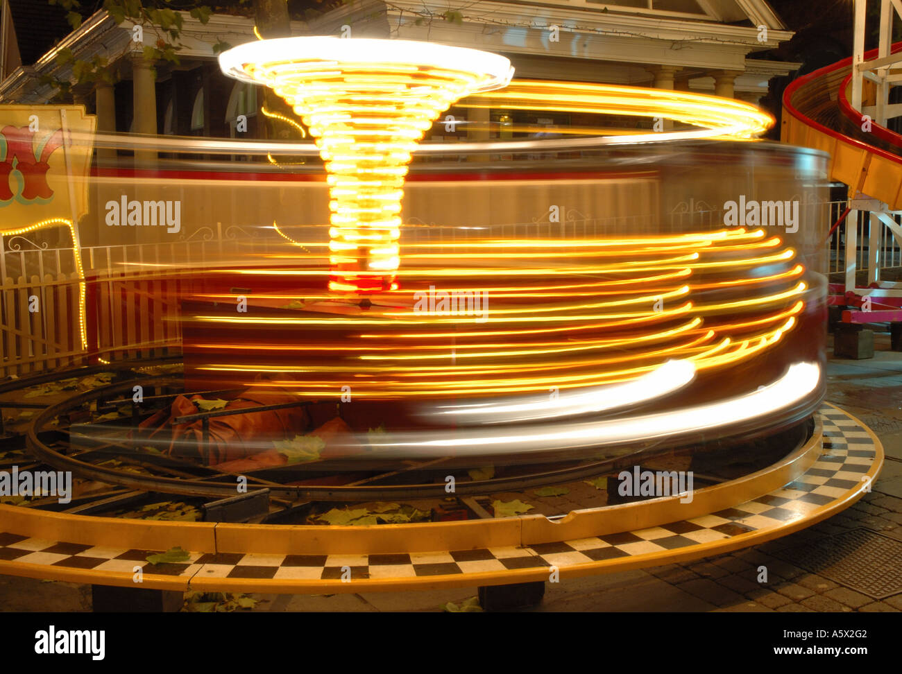 christmas fairground ride at night in blurred motion, York, England, UK