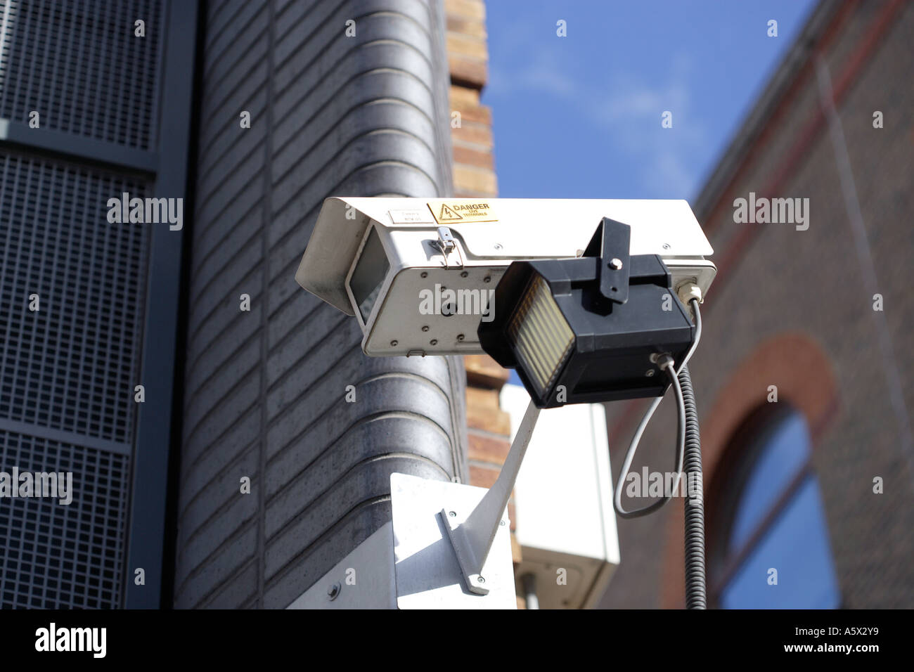 Security video camera guarding area Stock Photo