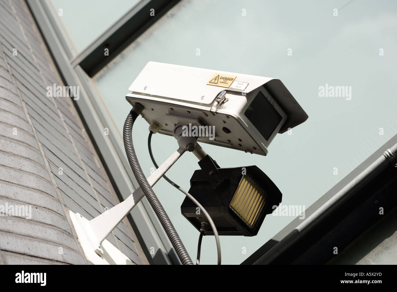 Security video camera guarding area Stock Photo