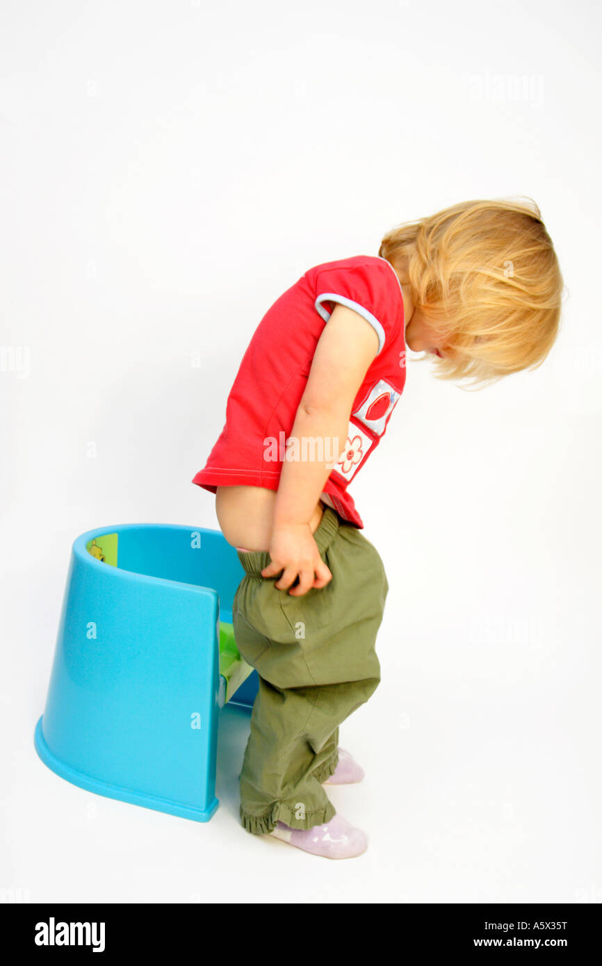 Toddler potty training in colour on white background Stock Photo