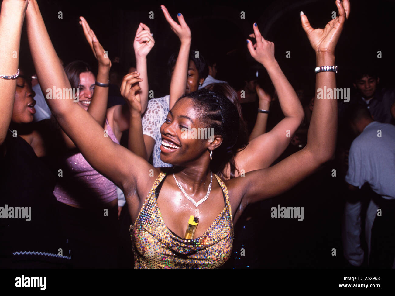 Girls dancing to bangra with their hands in the air at Naughty but Nice Limelight London Stock Photo