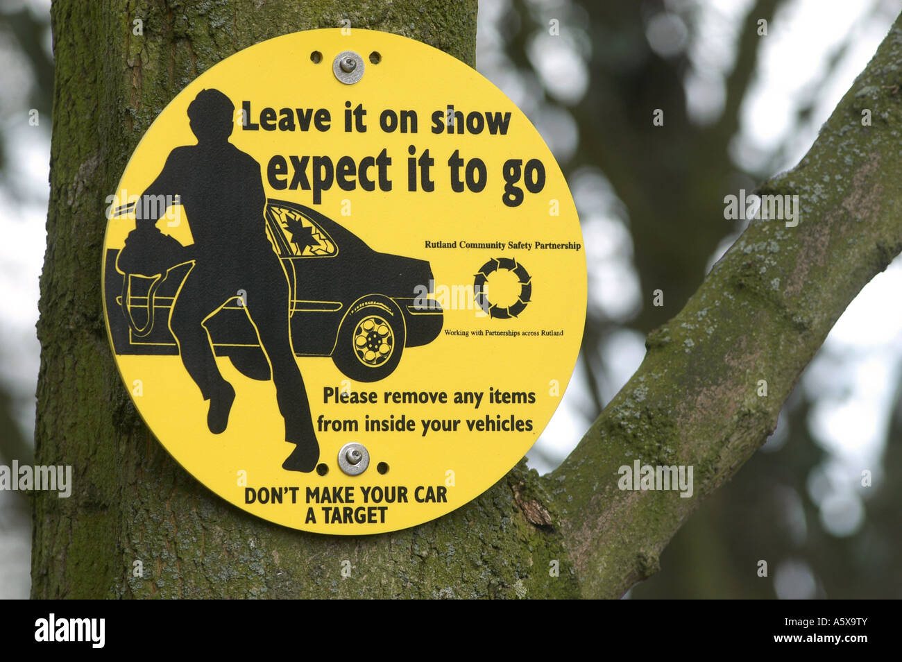 Warning sign about car theft in a car park to motorists in the uk Stock Photo