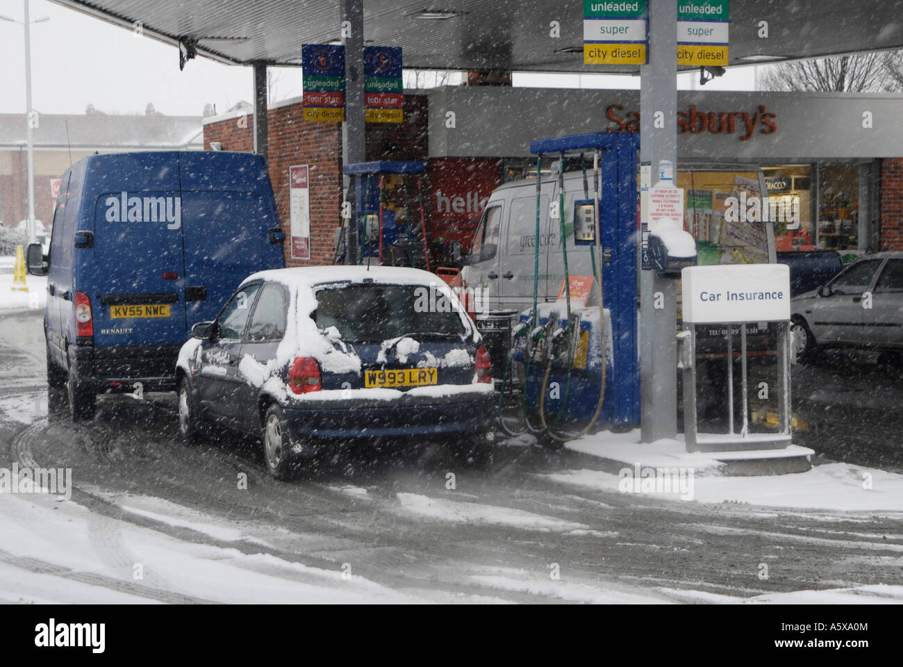 Vehicles filling up with fuel at a Sainsburys petrol station on a