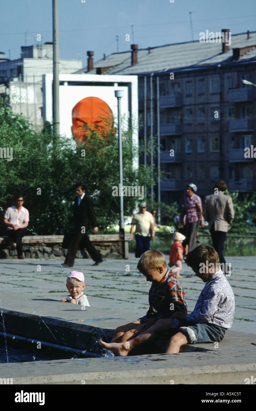 Children with Lenin poster in background, Bratsk, Siberia Stock Photo
