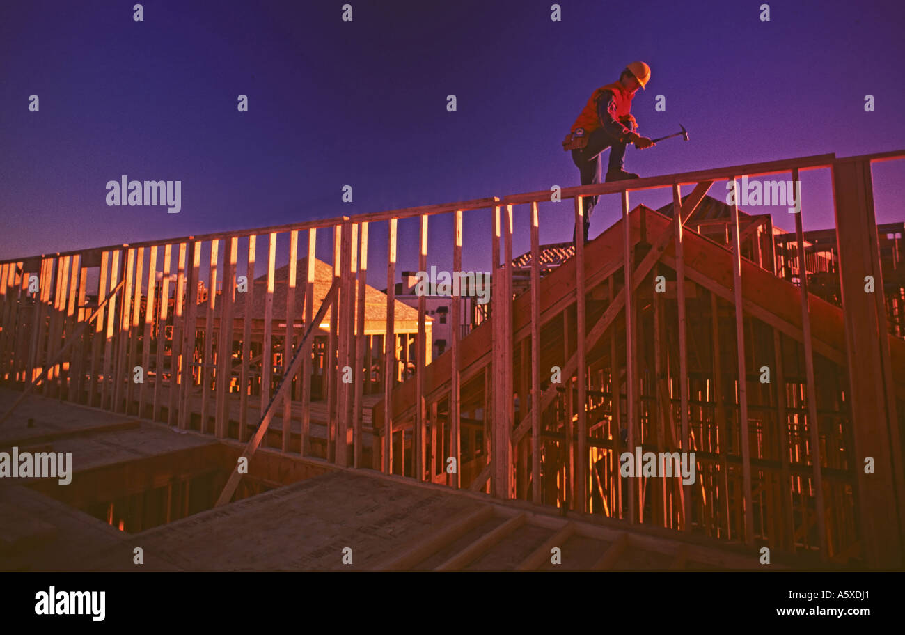 framing carpenter working on house Stock Photo Alamy