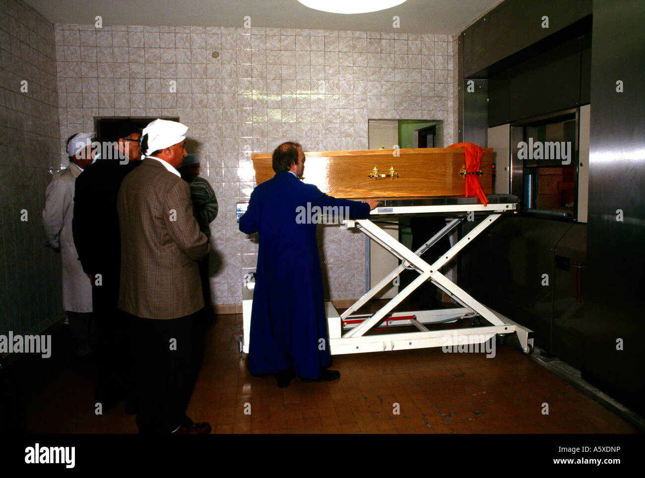 Sikh Funeral Charging Furnace And Putting Coffin In Furnace Stock Photo