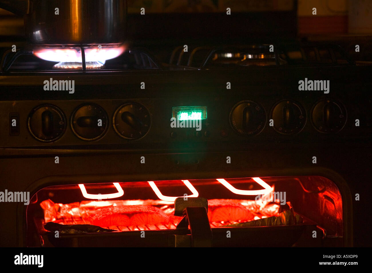 a gas hob and electric grill on a cooker Stock Photo Alamy