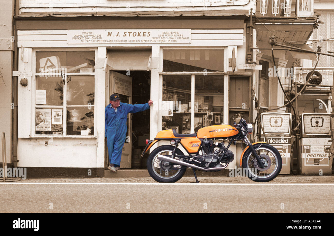 Old Man looking at Motorcycle in Stockbridge hampshire Stock Photo