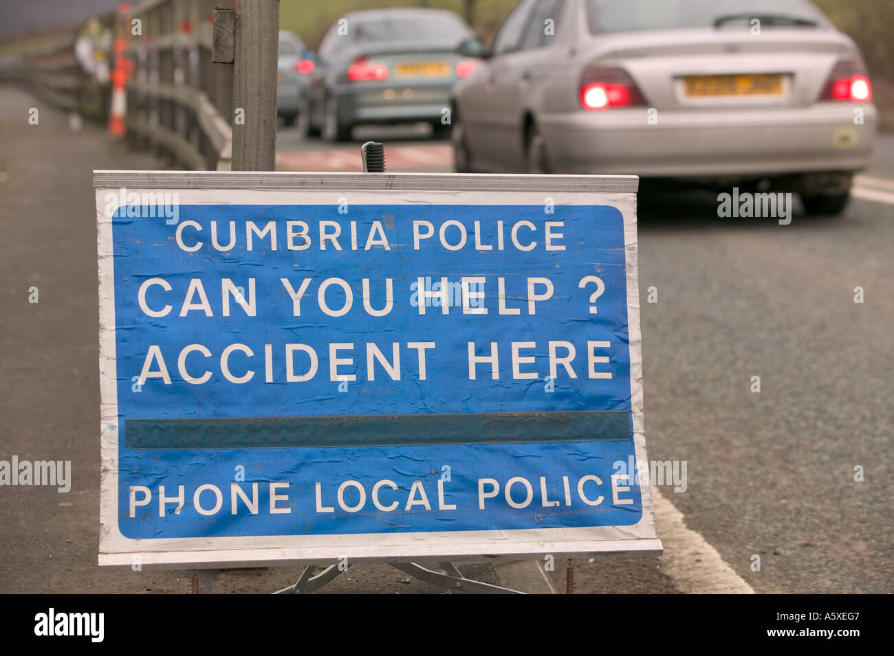 police accident sign at the site of a fatal road traffic accident near