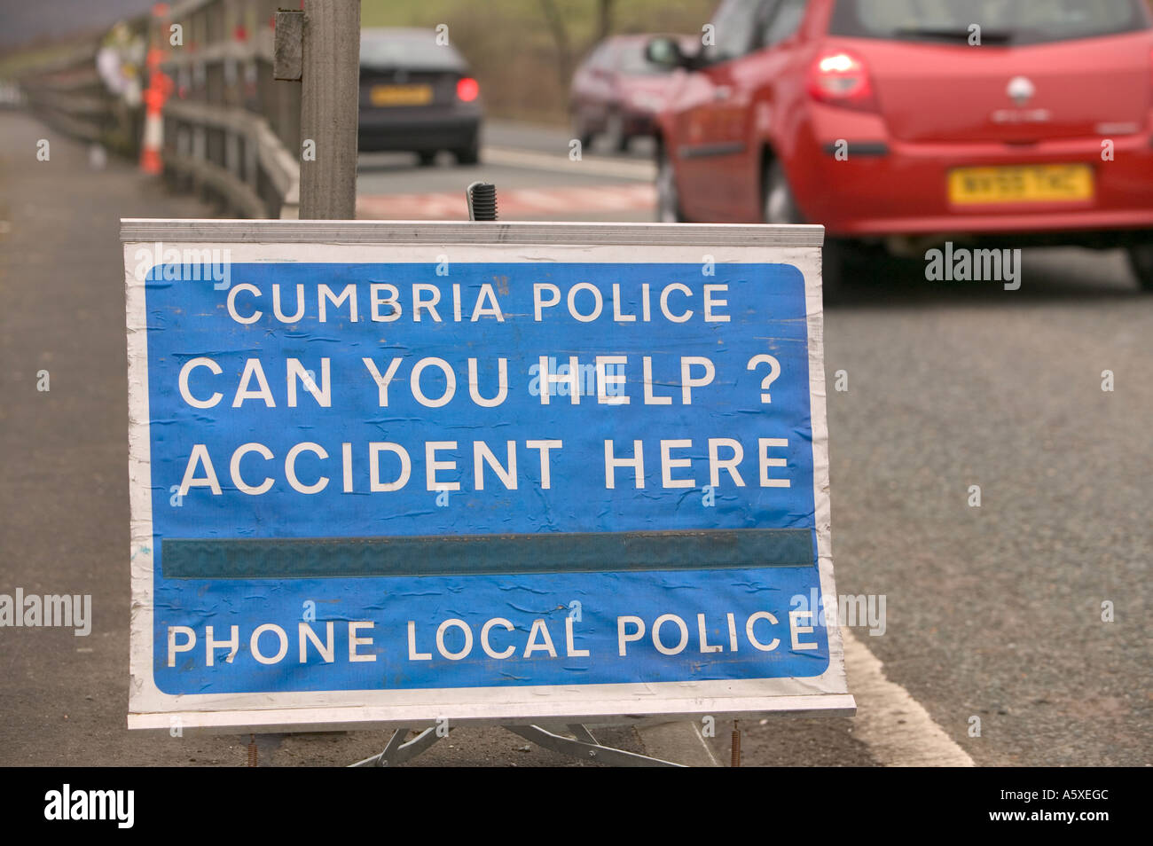 police accident sign at the site of a fatal road traffic accident near