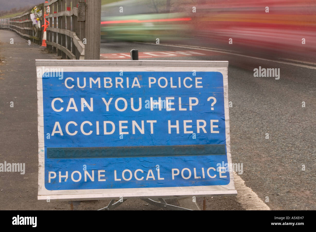 police accident sign at the site of a fatal road traffic accident near