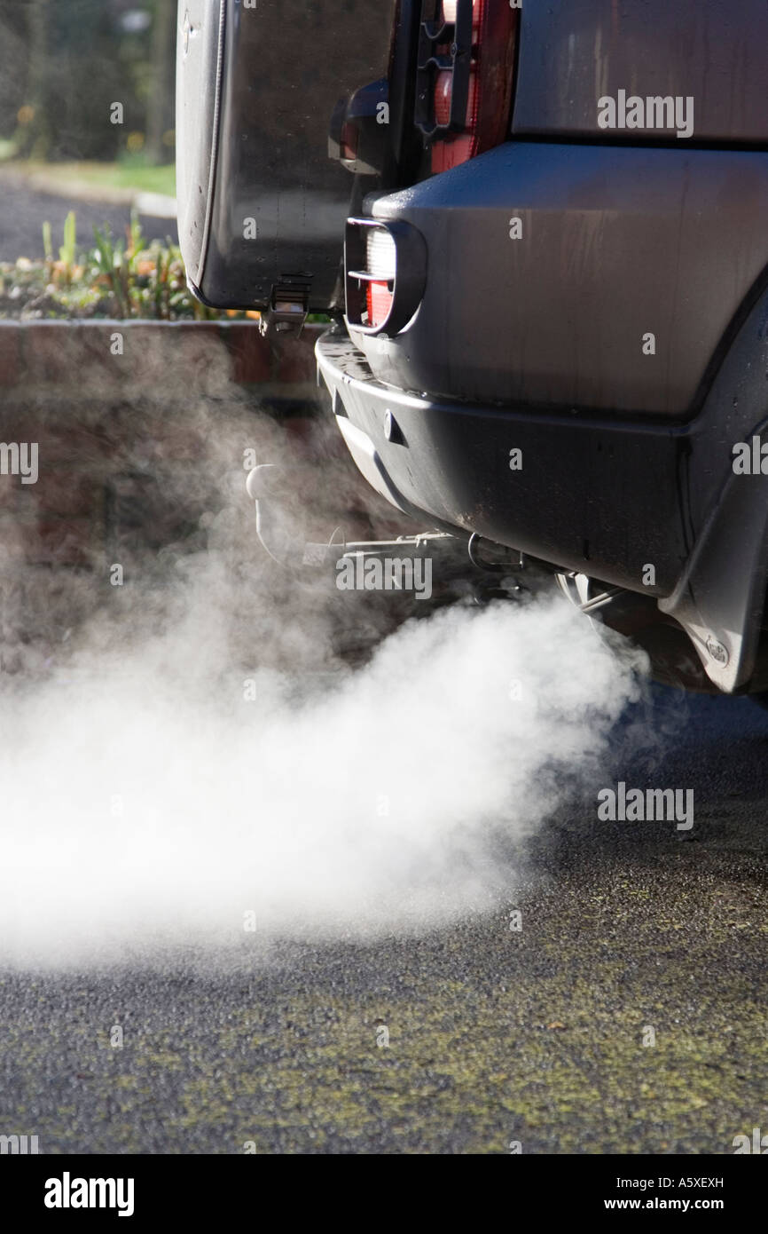 Exhaust cloud from a car. UK. Pollution and fumes from a vehicle. Stock Photo